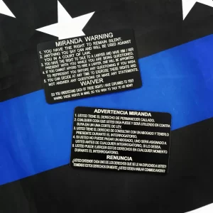 English / Spanish Metal Miranda Card on a blue and black flag background