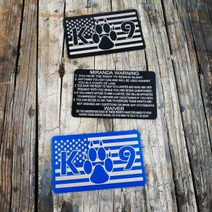 American Flag K9 Metal Miranda Card on a wooden table