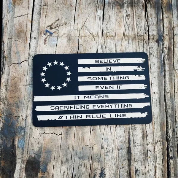 black miranda card with betsy ross flag design and "Believe in something even if it means sacrificing everything #thinblueline" transcribed on it