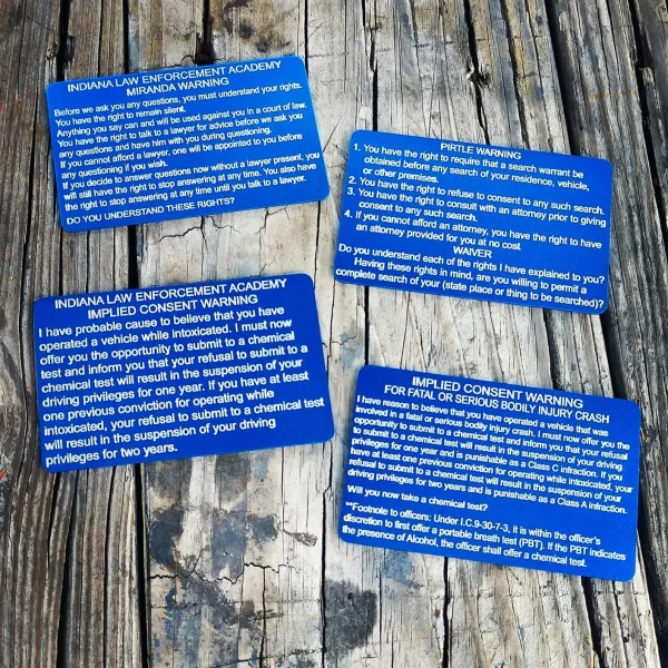 blue Indiana Miranda, Pirtle, Implied Consent, And Fatal Or Serious Injury Implied Consent Metal Cards on a wooden table